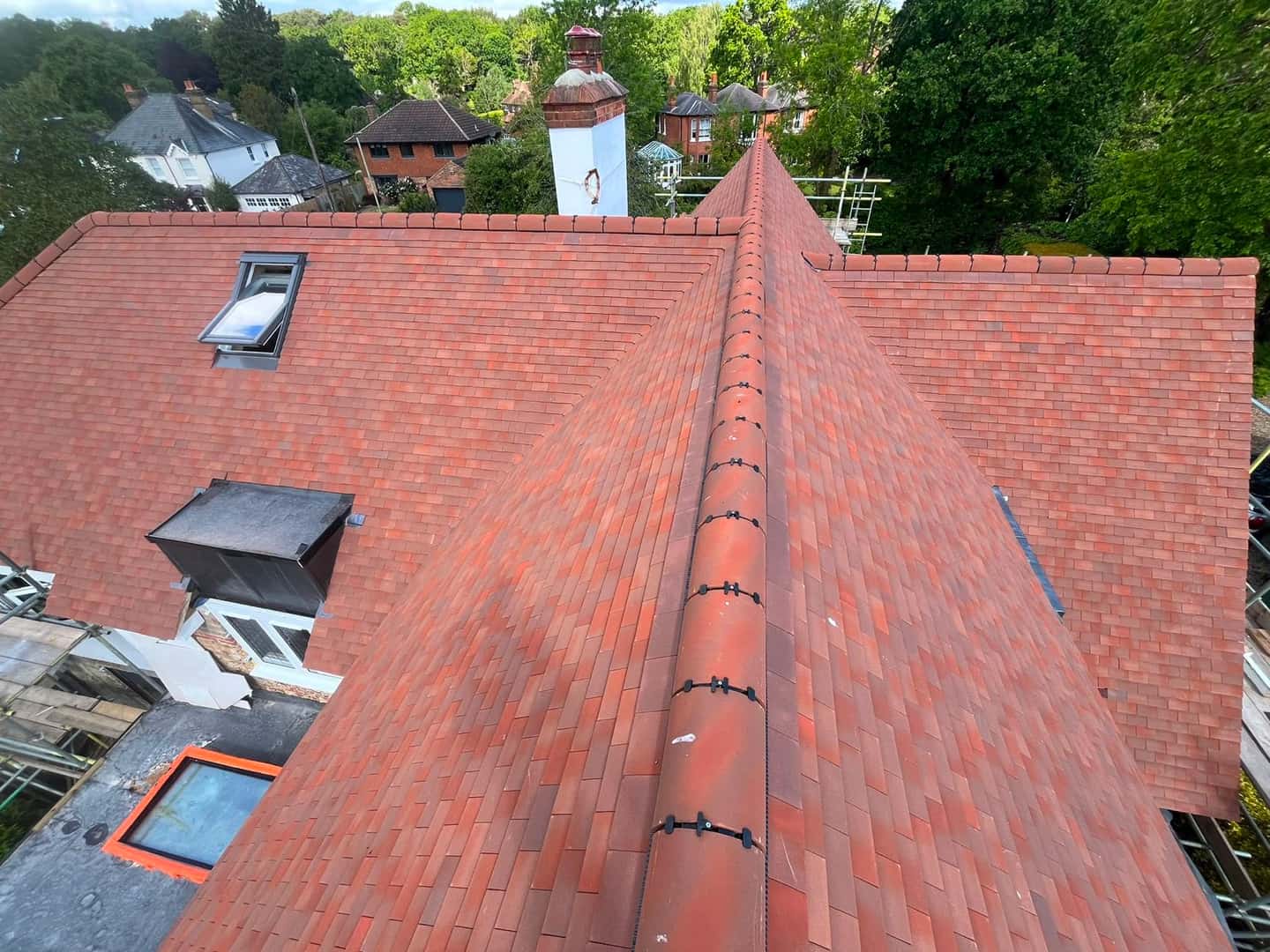 Freshly re-tiled clay roof completed by Kash Roofing